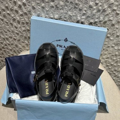 Prada Soft Leather Fisherman Cage Sandals in black.