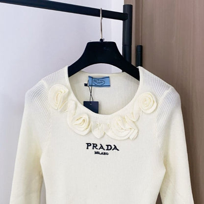 Prada ribbed knit sweater with floral appliqués on the collar
