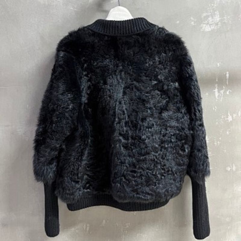 Christian Dior  faux-fur jacket featuring contrasting black knit sleeves, collar, and hem