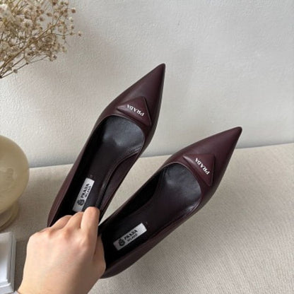 Prada 75mm Padded Triangle-Logo Leather Pumps.