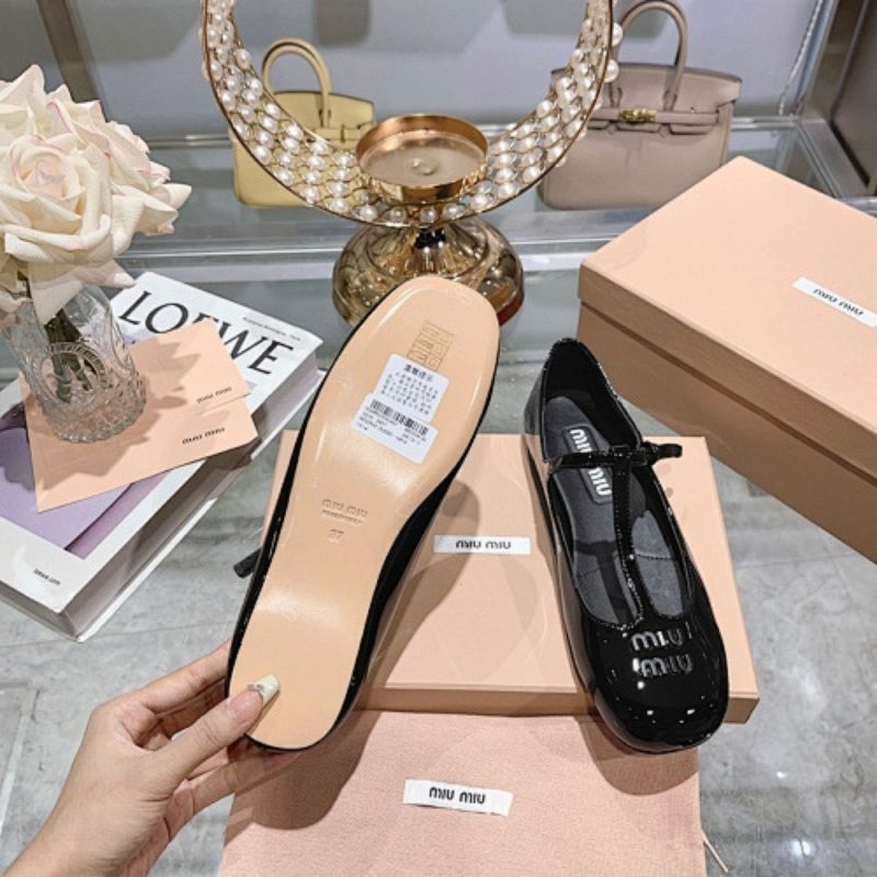 Miu Miu Logo-Lettering Patent Ballerina Flats in black.