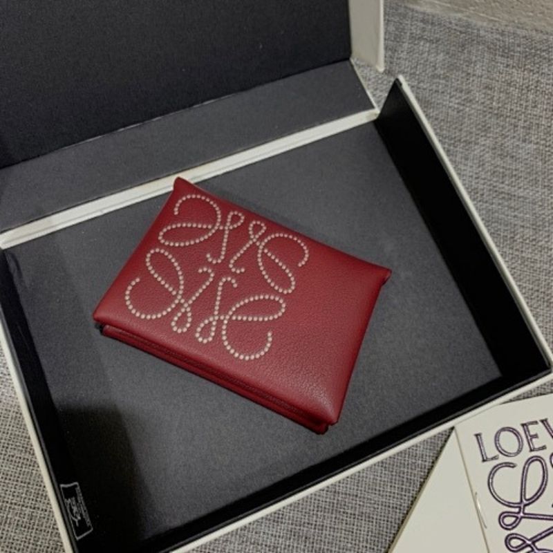 Loewe Trifold Anagram wallet in a deep red