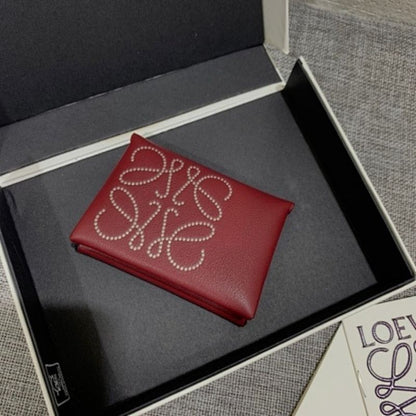 Loewe Trifold Anagram wallet in a deep red