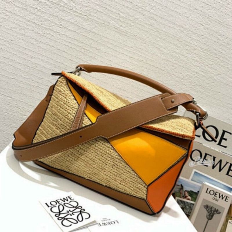 Loewe Puzzle Bag  natural raffia with color-blocked leather panels.