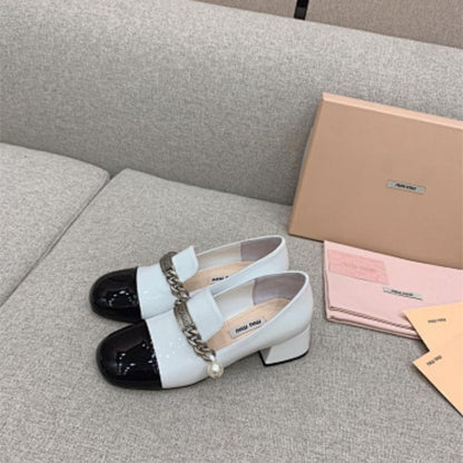 Miu Miu two-tone patent-leather loafer pumps black and white color-blocked design