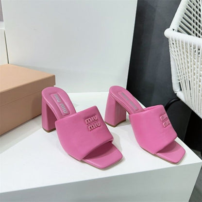 Miu Miu Logo-Embossed Block Heel Mules in pink