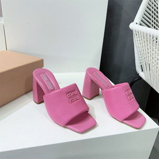 Miu Miu Logo-Embossed Block Heel Mules in pink
