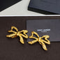 Saint Laurent Textured Bow Clip-On Earrings