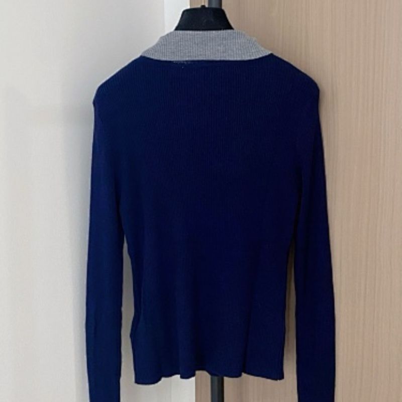 Christian Dior long-sleeved top with a grey collar and the signature Dior bee embroidery.