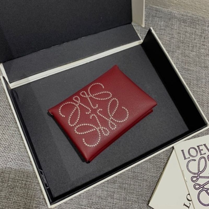 Loewe Trifold Anagram wallet in a deep red