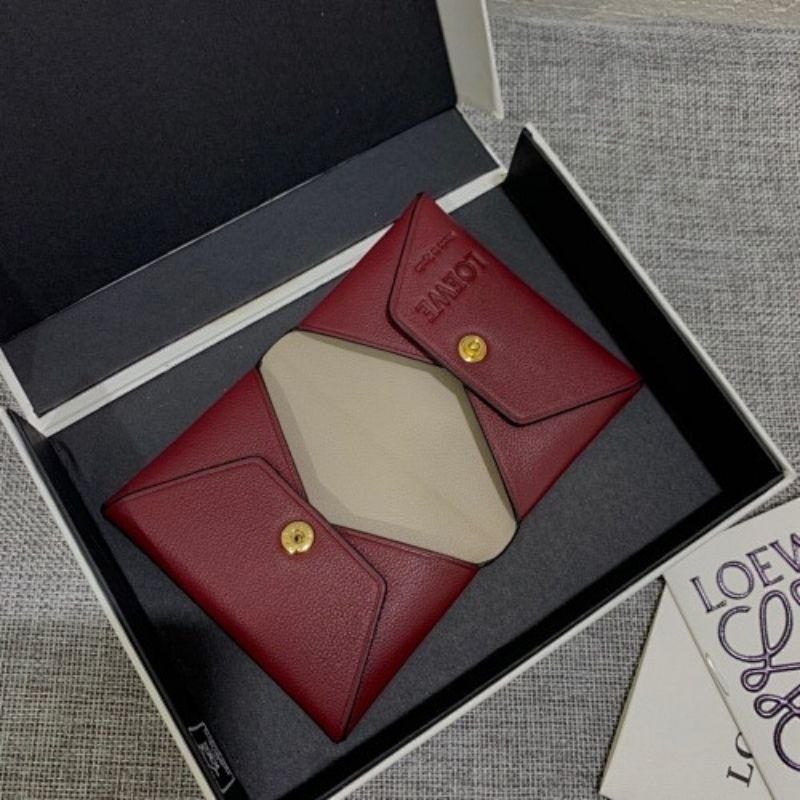 Loewe Trifold Anagram wallet in a deep red