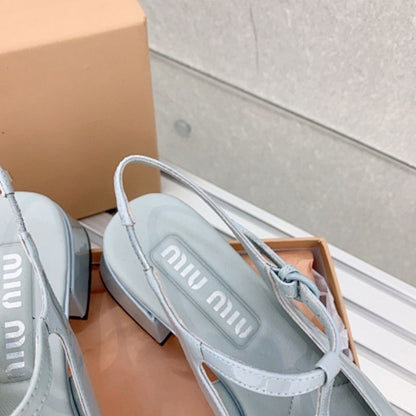 Miu Miu patent leather T-bar Mary Jane flats.