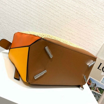 Loewe Puzzle Bag  natural raffia with color-blocked leather panels.