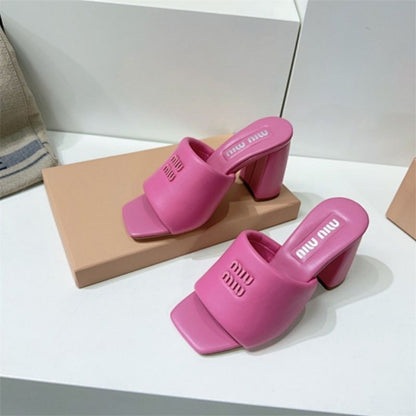 Miu Miu Logo-Embossed Block Heel Mules in pink