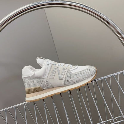 Miu Miu x New Balance 574 crystal-embellished sneakers.