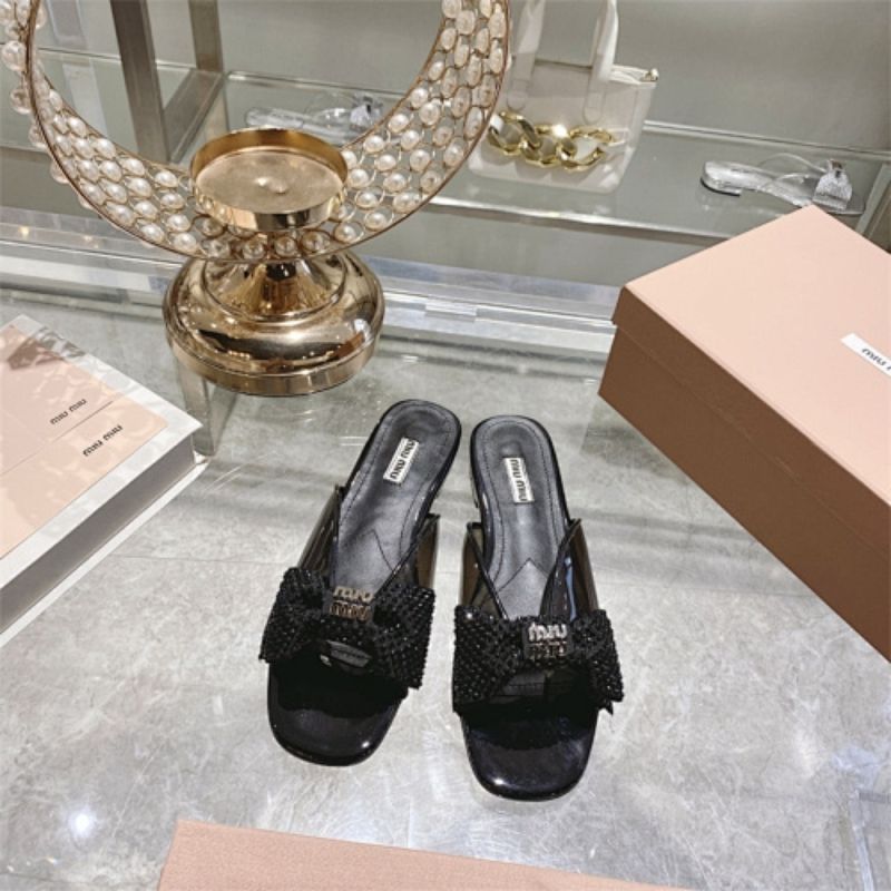 miu miu crystal embellished bow mules in black