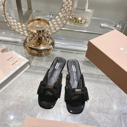 miu miu crystal embellished bow mules in black