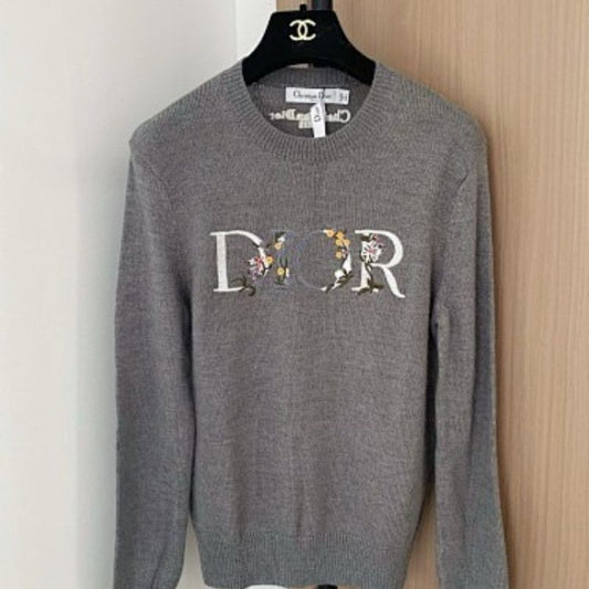 Christian Dior sweater with a distinctive large "DIOR" logo