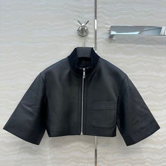 Hermès cropped, short-sleeve leather (or faux leather) jacket.