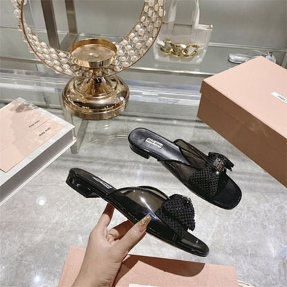 miu miu crystal embellished bow mules in black