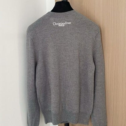 Christian Dior sweater with a distinctive large "DIOR" logo