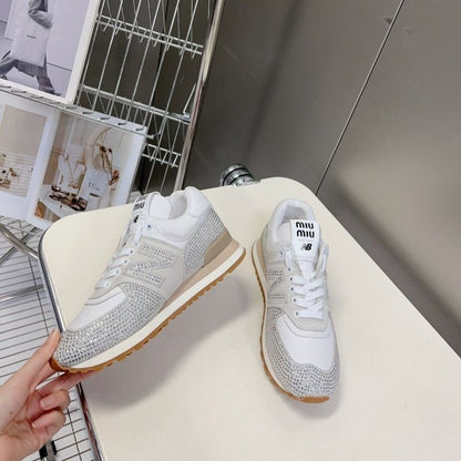 Miu Miu x New Balance 574 crystal-embellished sneakers.