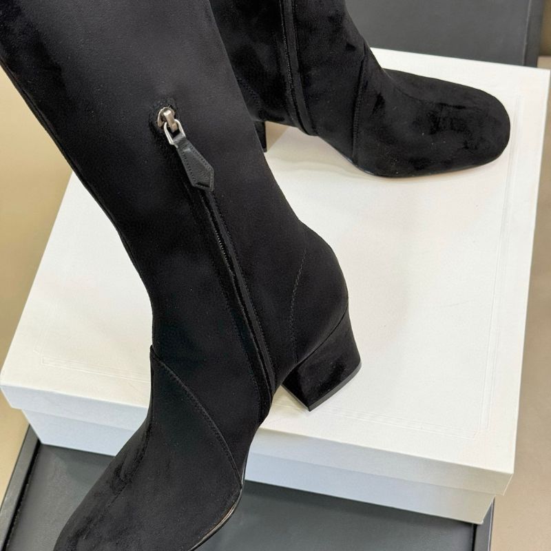 black suede knee-high boots.