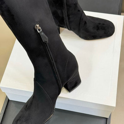 black suede knee-high boots.