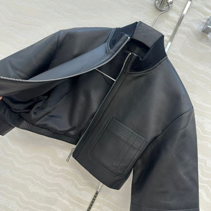 Hermès cropped, short-sleeve leather (or faux leather) jacket.