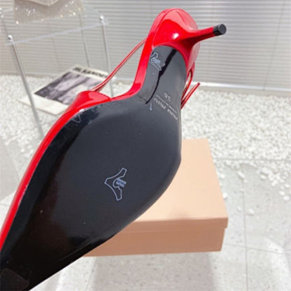 Miu Miu red patent-leather slingback pumps.
