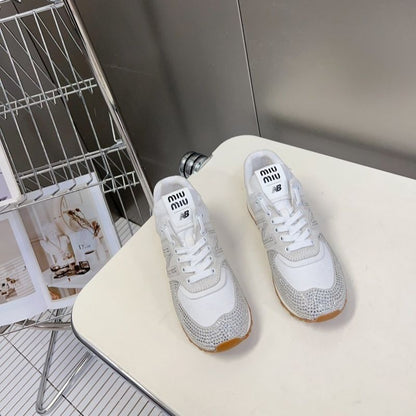 Miu Miu x New Balance 574 crystal-embellished sneakers.