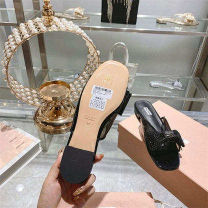 miu miu crystal embellished bow mules in black