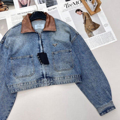 Prada cropped denim jacket with a brown leather collar.