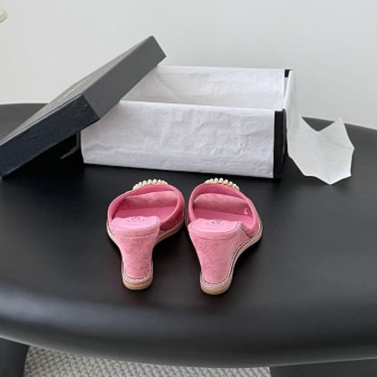 Chanel Pearl-Embellished Interlocking CC Suede Mules in bright pink.