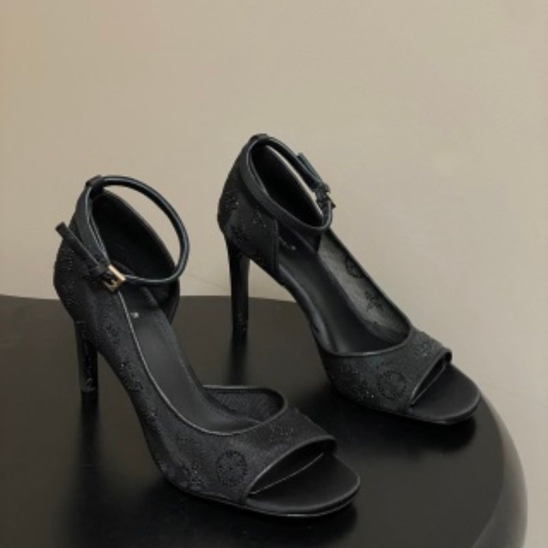 Louis Vuitton Gala Sandals in black.
