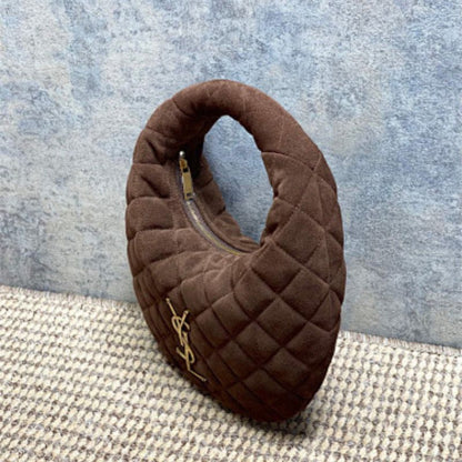 Saint Laurent Icarino a rounded top-handle bag .