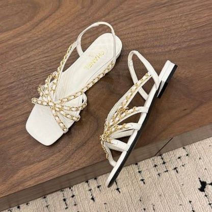 Chanel Interwoven Chain Flat Slingback Sandals in white.