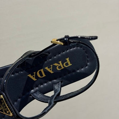 Prada Patent Leather Thong Sandals in classic black ("Nero")