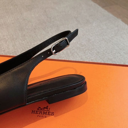 Hermès Innocente Slingback Flats in noir (black) leather,