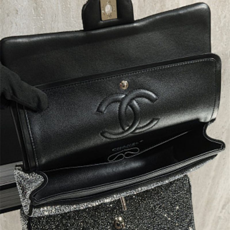 Chanel Rectangular Mini Flap Bag in black glitter.