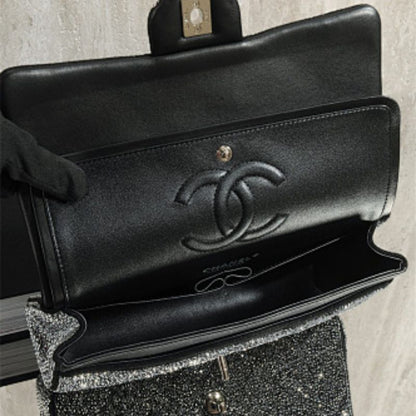 Chanel Rectangular Mini Flap Bag in black glitter.
