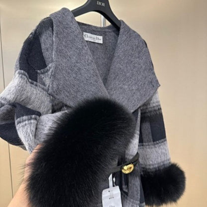 Christian Dior coat with black fur cuffs.