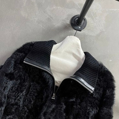 Christian Dior  faux-fur jacket featuring contrasting black knit sleeves, collar, and hem