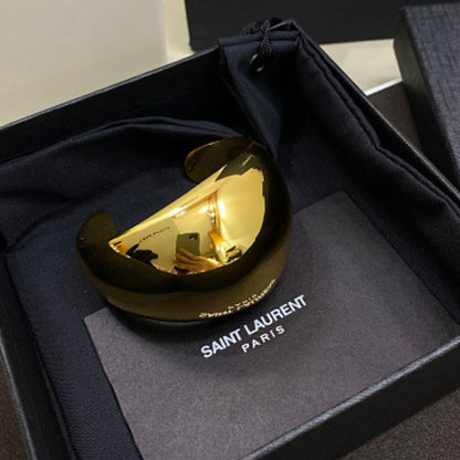 Saint Laurent Dome Cuff Bracelet in gold,