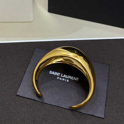 Saint Laurent Dome Cuff Bracelet in gold,