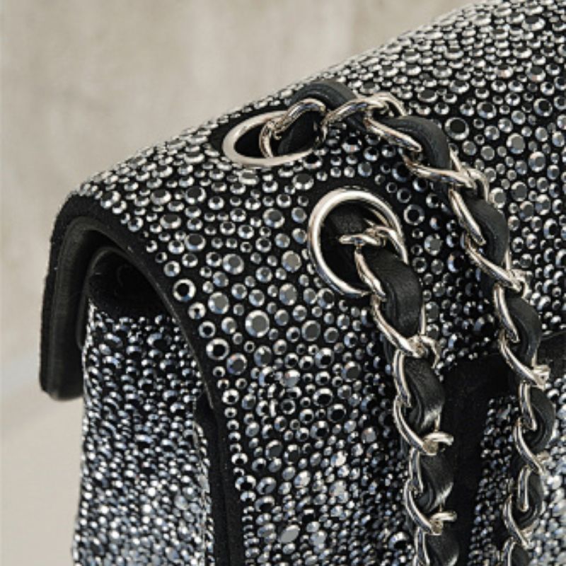 Chanel Rectangular Mini Flap Bag in black glitter.