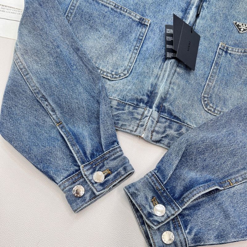 Prada cropped denim jacket with a brown leather collar.