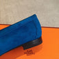 Hermès Paris Loafers in a striking monochromatic blue suede layout.