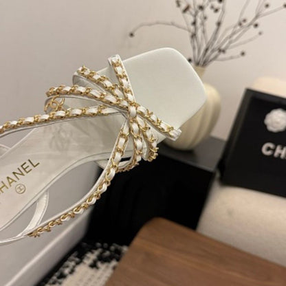 Chanel Interwoven Chain Flat Slingback Sandals in white.