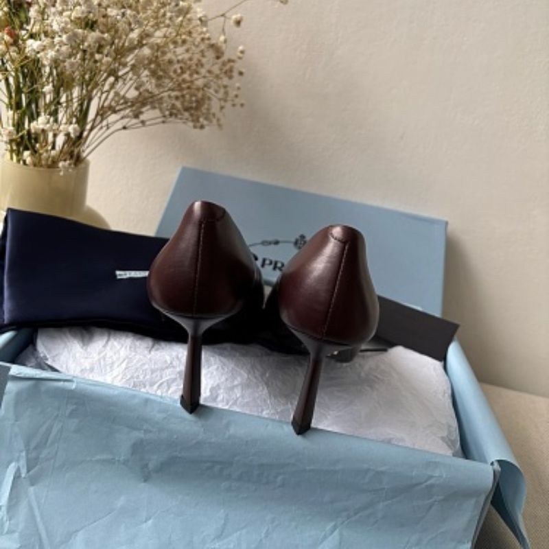 Prada 75mm Padded Triangle-Logo Leather Pumps.